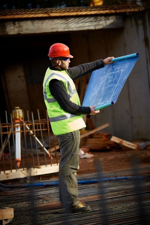 iStock_000025090240Small LOOKING AT BLUEPRINTS iStock_000025090240Small LOOKING AT BLUEPRINTS