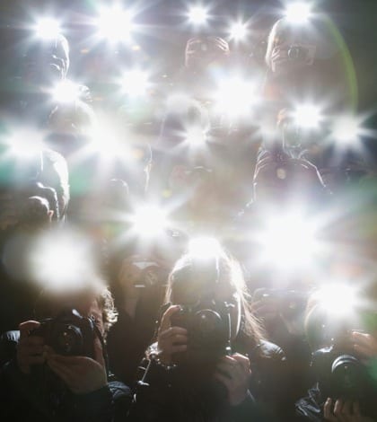 iStock_paparazzi Paparazzi taking pictures with flash