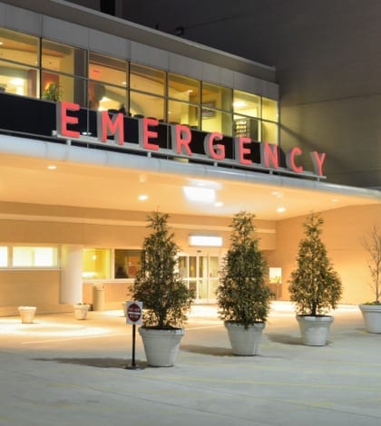 Emergency Room entrance at a hospital at night.