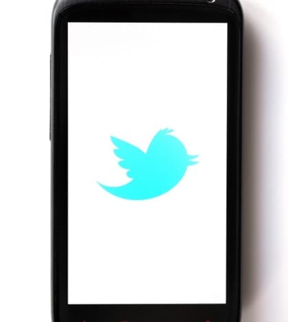 Bucharest, Romania - March 28, 2012: Twitter logo is displayed on a mobile phone screen. Twitter is an online social networking service and microblogging service that enables its users to send and read text-based posts.