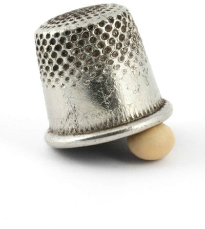 Thimble and pea isolated on white background Thimble and pea isolated on white background