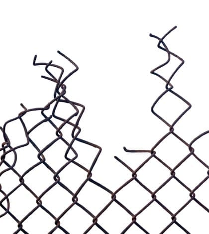 Grunge aged crushed rusty wire security fence isolated, vertical Grunge aged weathered crushed rusty wire security fence isolated, vertical copy space