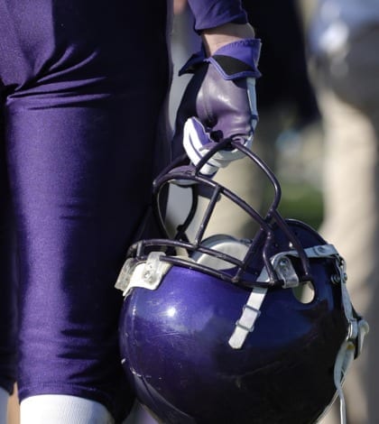 American Football American Football ammunition. Player hold's protective helmet