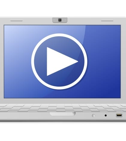Laptop and video service sign. Online video newspaper. Laptop and video service sign. Online video newspaper.