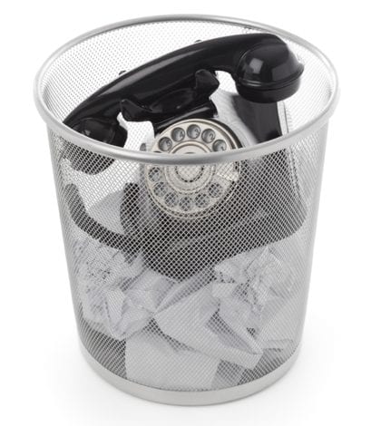 iStock_phone in trash iStock_phone in trash