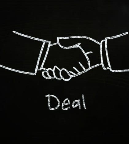 deal handshake illustration sketced with chalk on blackboard