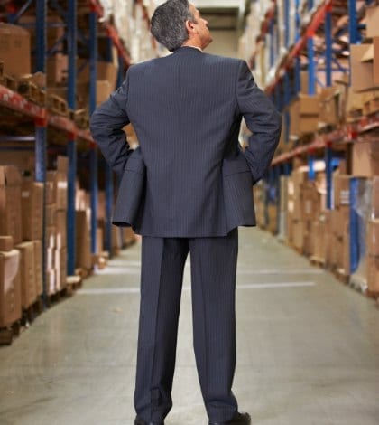 Rear View Of Manager In Warehouse