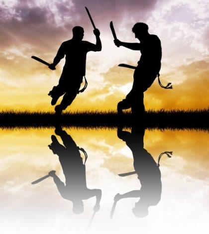capoeira with swords at sunset capoeira with swords at sunset