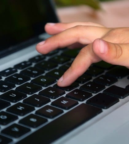 HAND ON KEYBOARD 000061652380 420 HAND ON KEYBOARD 000061652380 420