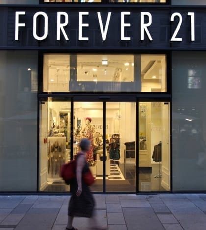 Forever 21 fashion VIENNA - SEPTEMBER 4: Shopper walks past Forever 21 store on September 4, 2011 in Vienna. Forever 21 fashion label has 480 stores worldwide and had USD 2.6 bn revenue in 2011.