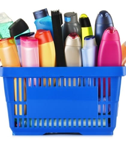 Plastic shopping basket with plastic bottles of body care and beauty products Plastic shopping basket with plastic bottles of body care and beauty products