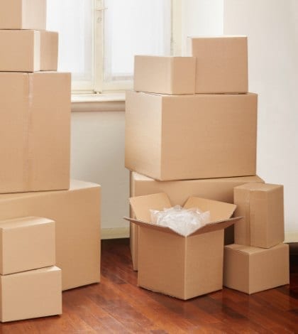 Cardboard boxes in apartment, moving day