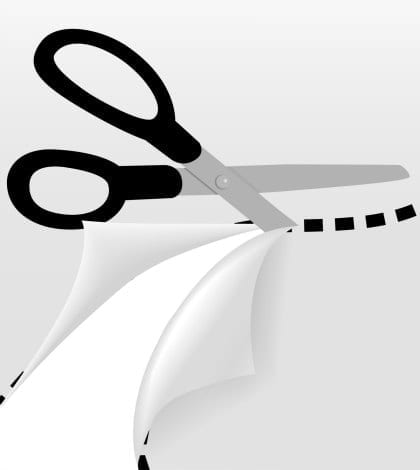 Scissors cut a wavy dotted line to separate a page into 2 pages and reveal part of the page underneath.