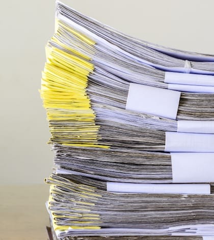 Pile of document waiting to be managed on background