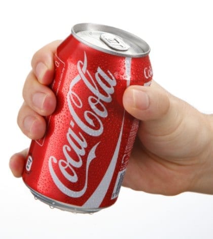 Kuala Lumpur,Malaysia 9th April 2015, hand holding a red Coca Cola can drinks.Coca Cola drinks are produced and manufactured by The Coca-Cola Company