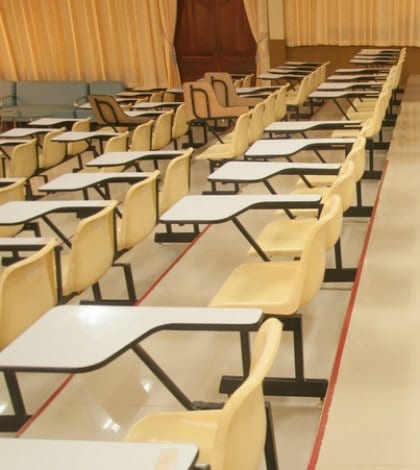 Lecture chairs in a class room with stair path
