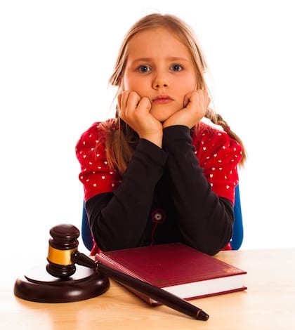 Pretty happy little girl and law gavel isolated little girl model isolated on white