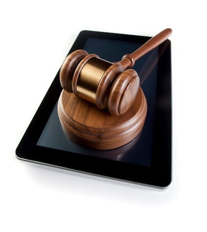 Legal & Digital Tablet Gavel & Digital Tablet on white. Concept for displaying law firm web site.