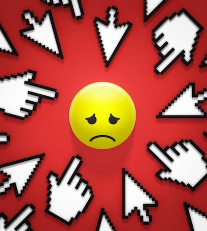 internet bullying hand and arrow cursors pointing at sad face