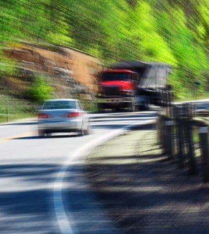 driving truck car texting 490527245 420 Stop sign with a symbol of a handheld device and the words Stop Texting printed on it. Image is blurred to imply motion and distraction. Symbol is artist own conceptual design.