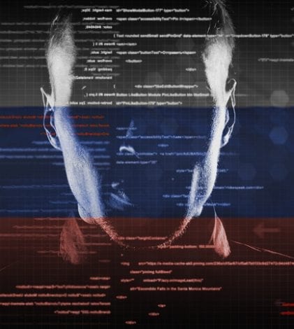 hacker at work with graphic user interface around with russian flag on background