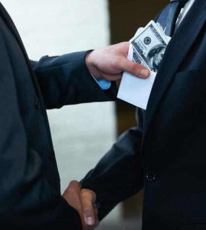 He's a rotten egg in the corporate world Two corporate businessmen shaking hands while one man places money in the other's pockethttp://195.154.178.81/DATA/i_collage/pi/shoots/781058.jpg