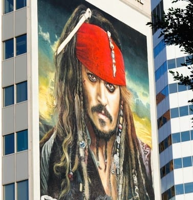 Los Angeles, California, USA - May 9, 2011: Billboard poster of the film "Pirates of the Caribbean: On Stranger Tides" on a facade of the Westwood Medical Plaza building. The movie, starring Johnny Depp and PenAlope Cruz, is distributed by Walt Disney Pictures. Westwood Medical Plaza is a business building complex on Wilshire Boulevard in the Westwood Village district of Los Angeles.
