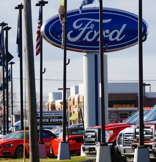 Rochester Hills, Michigan, USA - March 21, 2016: The Huntington Ford dealership on Rochester Road in Rochester Hills, Michigan. Founded in 1903 by Henry Ford, Ford Motor Company is a multi-national manufacturer of cars and trucks.