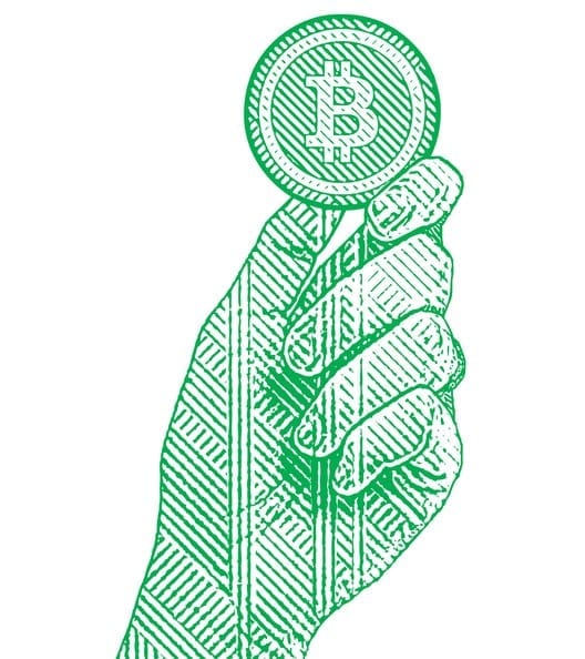 Engraving illustration of a hand holding a bitcoin