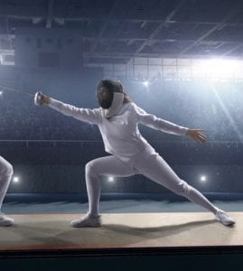 woman lunging in fencing outfit