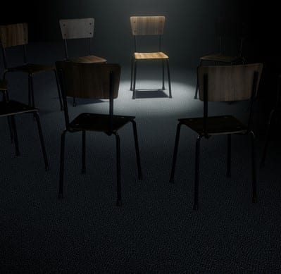 A 3D render concept of a group of chairs in a circular formation with one chair highlighted by a single moody spotlight on a dark background