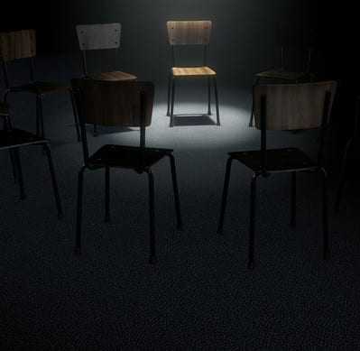 Group Therapy Chairs A 3D render concept of a group of chairs in a circular formation with one chair highlighted by a single moody spotlight on a dark background