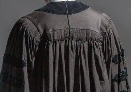The Judge walks away Back view of a young judge