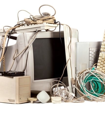 Pile of used, obsolete electronics. E-waste is becoming a major problem worldwide.