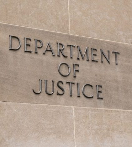 Department of Justice Sign Washington, DC - July 12, 2017: United States Department of Justice sign in Washington, DC on July 12, 2017