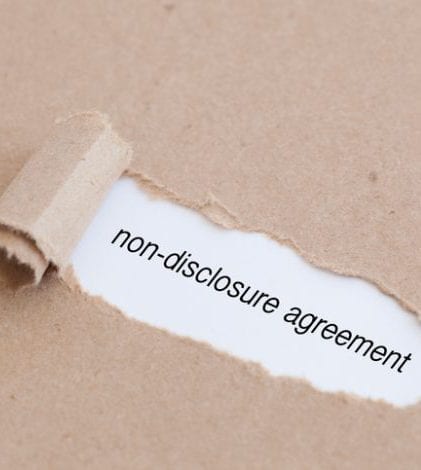 Non disclosure agreement Non disclosure agreement written under torn paper.