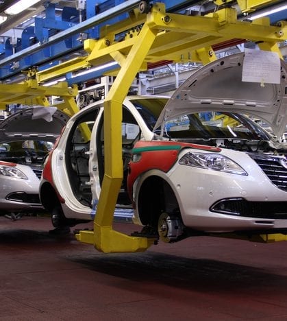 Cars production line Tychy, Poland - June, 16th, 2011: Cars production line in Fiat factory in Poland. The Assembly Plant ensures both the production of the Fiat range models (Panda II, 500), Lancia/Chrysler Ypsilon and Ford Ka. The manufacturing line was adapted for an annual capacity of 600,000 cars