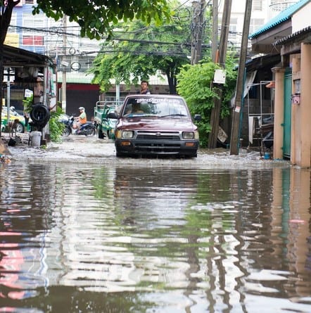 Bangkok, Thailand - October 12, 2015: Bangkok, Thailand, Oct 12 2015: The car navigating through the flood after the heaviest monsoon rain in the capital on Oct 12,2015 Bangkok, Thailand.