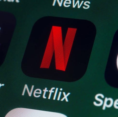 Netflix, BBC iPlayer, News, Speedtest and other Apps on iPhone screen London, UK - July 31, 2018: The buttons of the streaming app Netflix, surrounded by BBC iPlayer, Speedtest, News and other apps on the screen of an iPhone.