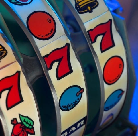 A close-up view of an old slot machine winning numbers.
