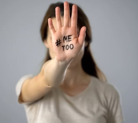 Woman with me too sign on hand, movement against sexual harassment