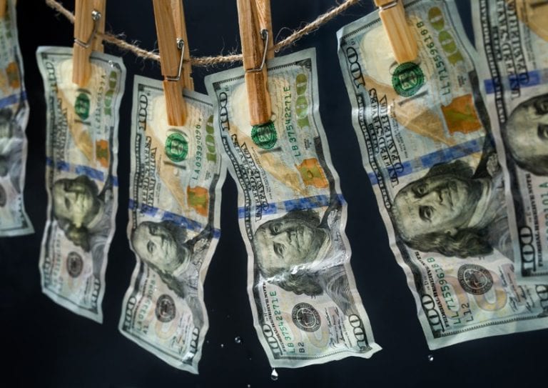 laundered-dollars-hanging-on-a-rope-picture-id467375870 laundered dollars