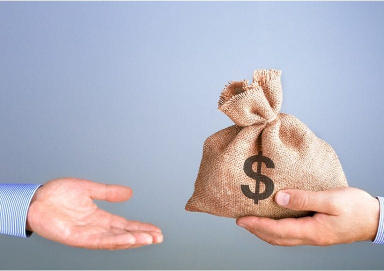 man-holds-gives-a-bag-of-money-in-hand-like-a-bonus-businessman-bag-picture-id1185417262 (1)