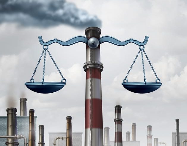 Environmental Law Environmental law symbol as an industrial smoke stack shaped as a justice scale as a metaphor for pollution regulations and clean air legislation with 3D illustration elements.