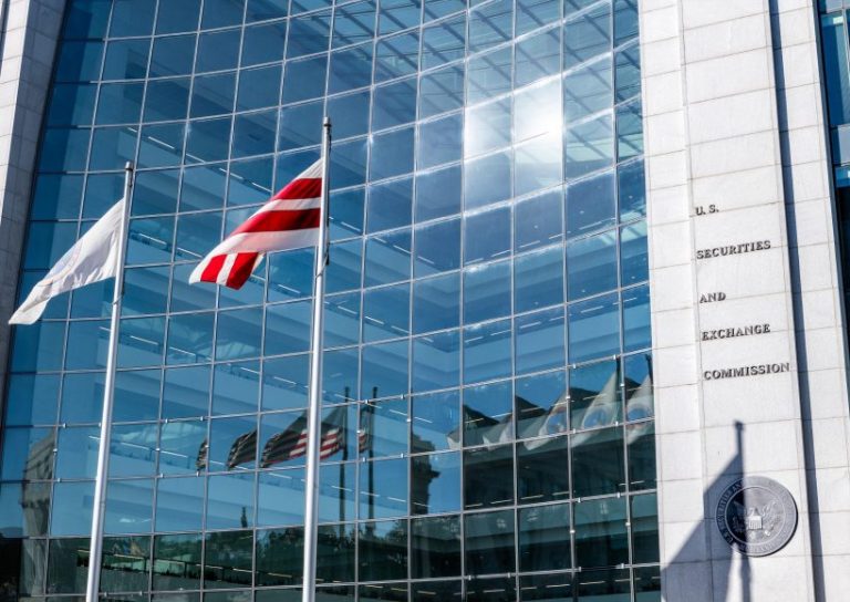 United States Securities and Exchange Commission SEC architecture closeup with modern building sign and logo with red flags by glass windows Washington DC, USA - October 12, 2018: United States Securities and Exchange Commission SEC architecture closeup with modern building sign and logo with red flags by glass windows