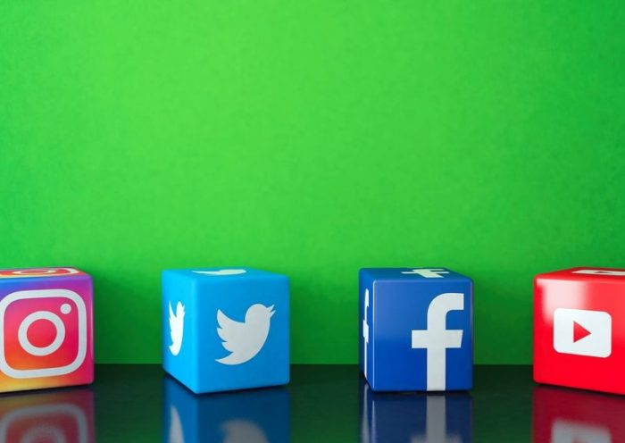 Marble Cubic Social media services icons on black glass with green copy space Istanbul, Turkey - October 26, 2019: Marble Cube shape of popular social media services icons, including Facebook, Instagram, Twitter, Youtube on black glass with green copy space