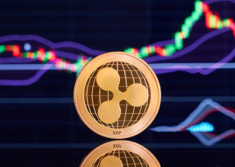 Gold ripple stacked on a bright background of business graphics close-up. Ripple crypto-currency. Anonymous. Virtual currency Gold ripple stacked on a bright background of business graphics close-up. Ripple crypto-currency. Anonymous. Virtual currency