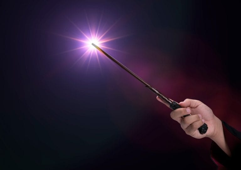 magic-wand-with-sparkle-on-blue-background-miracle-magical-stick-on-picture-id1215455963