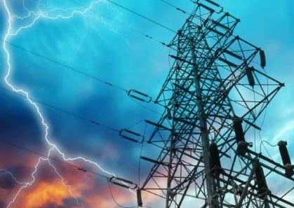 Dramatic Image of Power Distribution Station with Lightning Striking Electricity Towers
