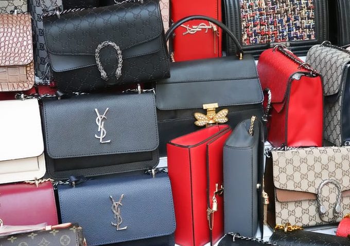 Bunch of fake brand bags at the bazaar. Istanbul, Turkey, September 22., 2018: Bunch of fake brand bags at the bazaar